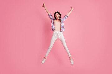 Full length body size photo funny amazing beautiful her she lady star shape figure jumping high wear shoes casual checkered plaid shirt white jeans denim clothes outfit isolated pink background - obrazy, fototapety, plakaty