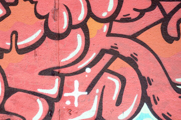 Colorful background of graffiti painting artwork with bright aerosol outlines on wall. Old school street art piece made with aerosol spray paint cans. Contemporary youth culture backdrop
