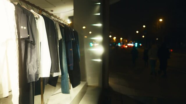 Blurred image of buildings window with clothes on hanging racks