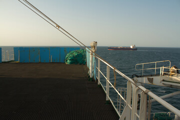 Obraz premium View of the vessel hardening metal plates on the bridge wing of a ship at sea