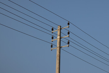 Electric post and blue sky