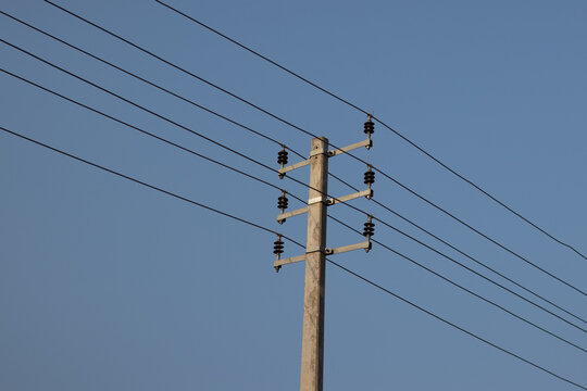 Electric post and blue sky