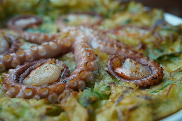 Korean-style pancakes with whole octopus and green onion