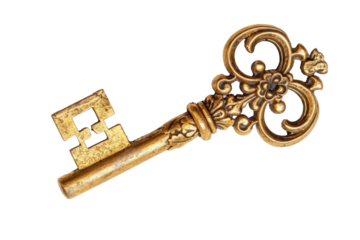 vintage key made of yellow metal, insulated. cut out. an old golden key.