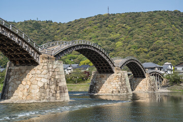 Iwakuni, Japan at Kintaikyo Bridge over the Nishiki River on a sunny day
