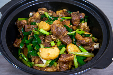 A pot of delicious braised duck with water chestnuts, home cooking