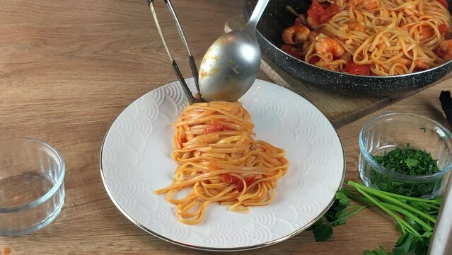plating Linguine with shrimp and cherry tomatoes