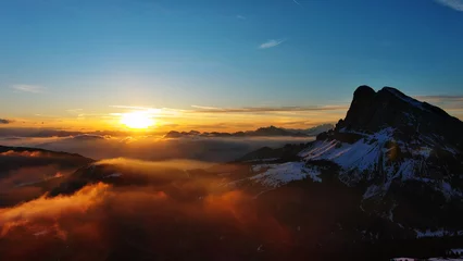 Fotobehang Slaapkamer Rocky snow mountains and sunrise sun  © Kokhanchikov