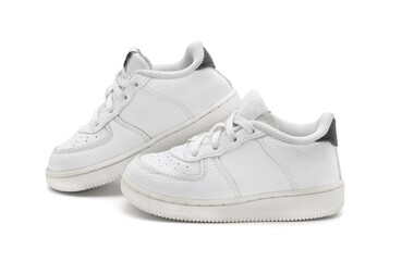 New unbranded fashion stylish white sport walking kid shoes or sneakers isolated on white background.