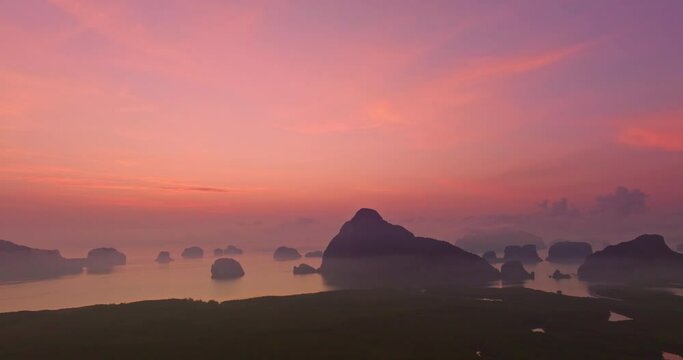 Aerial view Scenery High peaks wonderful pink sky at sunrise above Samed Nang Chee viewpoint. .tropical landscape background..scenery romantic sky of sweet sunrise above Samet Nangshe Islands.