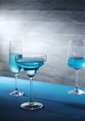 Glasses with blue alcohol cocktail ready for a party