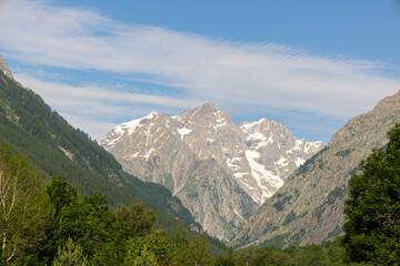 Fototapeta na wymiar High peaks in valley bottom