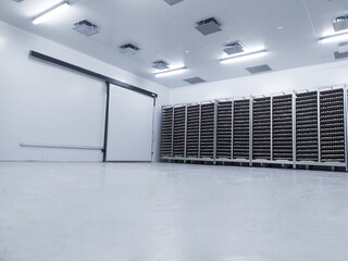  Several trolleys contain hatching eggs in the egg storage room so that the temperature of the eggs...