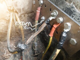 Burnt ground cable, failure in the industrial electrical installation grounding system. Failure earth system concept.
