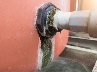 The outlet pipe line in the water reservoir is mossy due to a water leak.