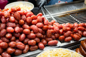 Vendor selling sausage in the street market