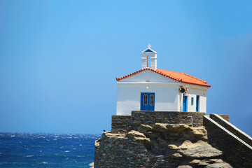 andros island greece panagia thalassini church wavy sea - obrazy, fototapety, plakaty