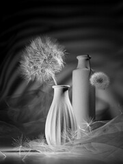 Modern still life with a large dandelion in a vase