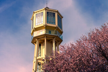 Siofok water lookout tower with blooming tree in Hungary spring travel