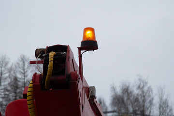 An orange beacon on a special service vehicle. Road equipment.