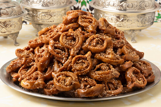 Plate with traditional Moroccan fresh baked chebakia close up on the table for ramadan 