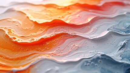 Close-up of liquid waves with a gradient from warm to cool tones, creating a dynamic and artistic texture.
