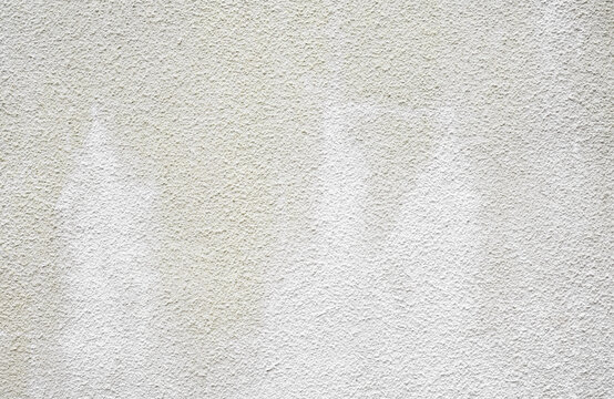 Stucco White Wall Texture Background,Dirty Grey Concrete Rough Surface Exterior Wall From Rain with Natural Light. Cement with rough plaster for design backdrop for spring summer