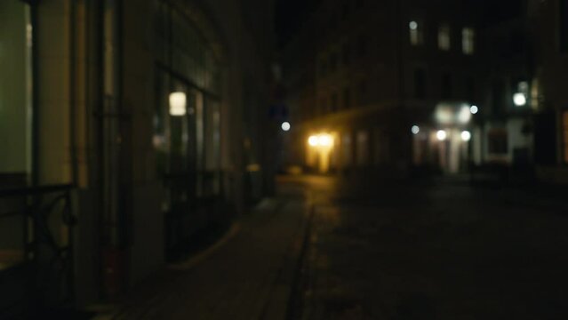 a blurry picture of a dark alleyway at night