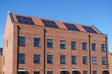 New modern apartment buildings with solar panels on the roof