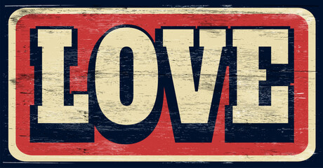 Aged vintage love sign on wood