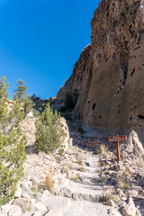 Naklejka premium Bandelier National Monument, New Mexico. Frey Trail was main route to enter and exit Frijoles Canyon before road was built. Trail begins at Juniper Campground then switchbacks down to the canyon floor