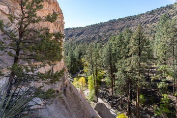 Bandelier National Monument preserves Ancestral Puebloans home in New Mexico. View of Frijoles Canyon from Alcove House. Trail to Alcove House over Frijoles creek. 