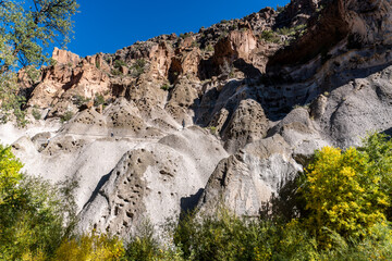 Bandelier National Monument in New Mexico. Hot ash from volcano at Valles Caldera cooled and welded into rock called tuff. Pajarito Plateau and Frijoles Canyon show Volcanic Geology. Pueblo Loop Trail
