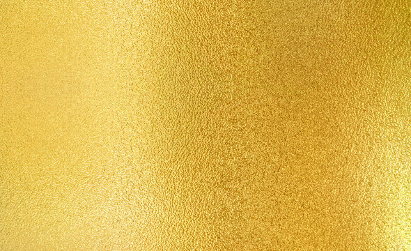 Luxury gold gradient light shiny glitter texture background. Golden shiny foil gradient metallic metal polished sheet with gloss light reflection, vibrant golden metal wall wallpaper