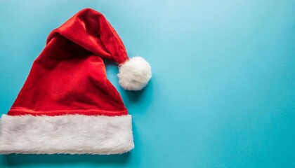 Obraz na płótnie Canvas festive christmas santa hat isolated on a plain background