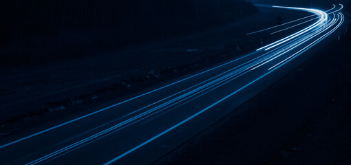 blue car lights at night. long exposure