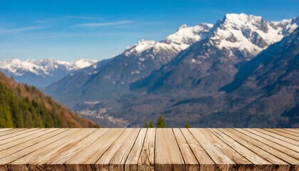 the empty wooden table top with blur background of alpine with snow capped exuberant image