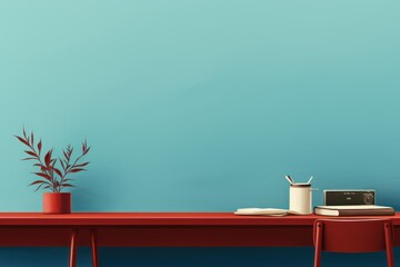 Red: An office desk and chair with red wall and a plant that sits on the shelf