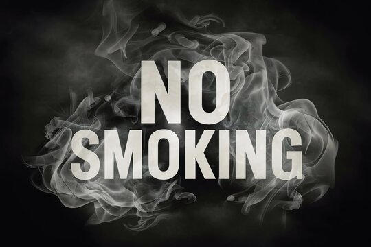 The word No Smoking is surrounded by smoke on dark background, Creative message on Smoking kills.