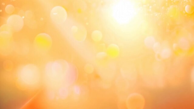 Abstract background with soft yellow and orange bokeh lights.