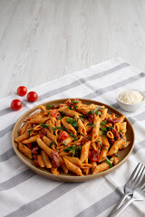 Homemade One-Pot Creamy Tuscan Pasta on a Plate, side view.