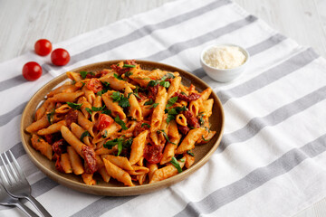 Homemade One-Pot Creamy Tuscan Pasta on a Plate, side view.