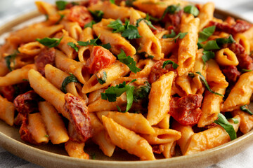 Homemade One-Pot Creamy Tuscan Pasta on a Plate, side view.