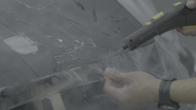 Gluing the ppf film on the car with the steam