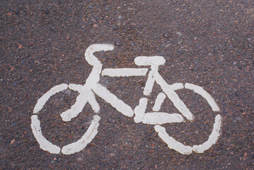 Road markings painted with white paint. Signs on the sidewalk and road. Drawing.
