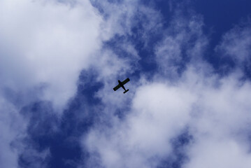 Military retro plane from the Second World War in the blue sky. Retro technology. Airplane.