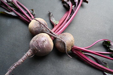 Beetroot on black background. Its other names  beets, table beet, garden beet, red...