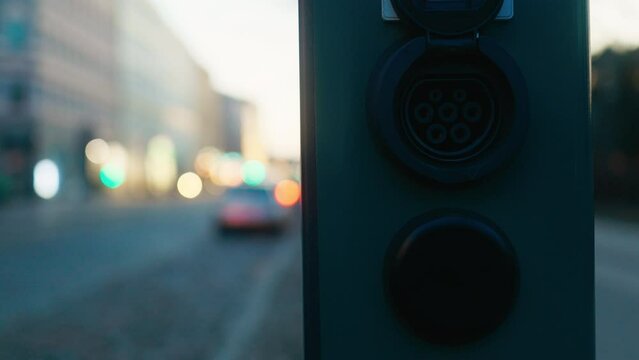 Sustainable Transportation: Close-Up of Car's Electric Blue Charging Port, Emblem of Automotive Evolution
