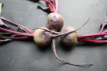 Beetroot on black background. Its other names  beets, table beet, garden beet, red...