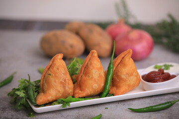 Samosa Indian famous street food snack closeup with selective focus and blur